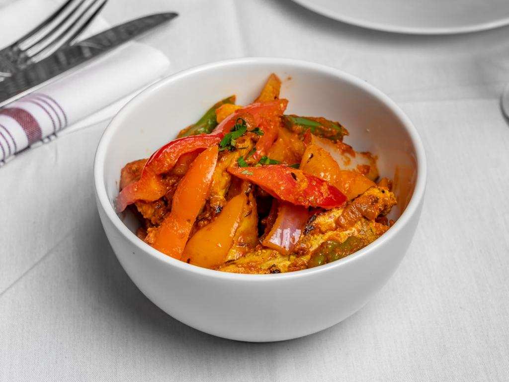 CHICKEN JALFREZI-Boneless chicken tikka, tomatoes, onion, bell peppers and spices